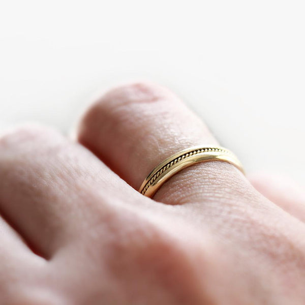 yellow gold romise ring set with braided filigree