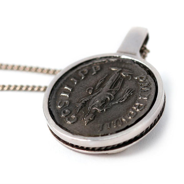 back side of roman coin in silver or white gold necklace