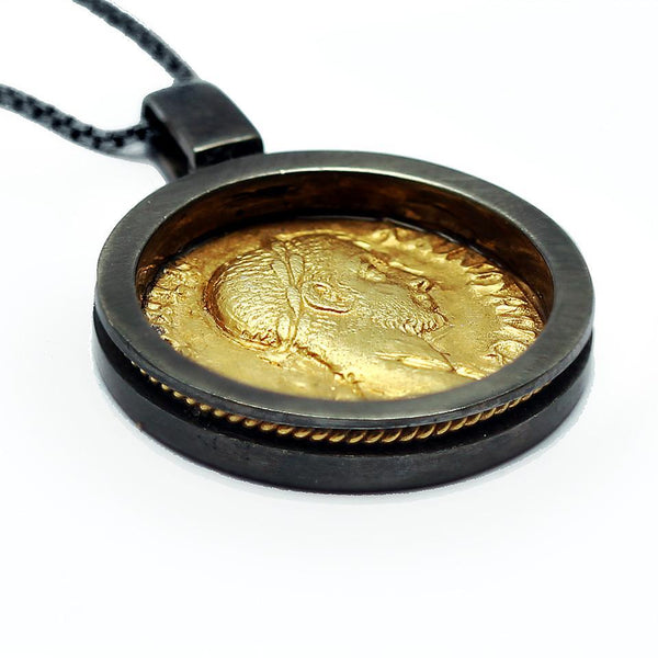 necklace with a a replica of a genuine antique Roman coin black and gold tone pendent 