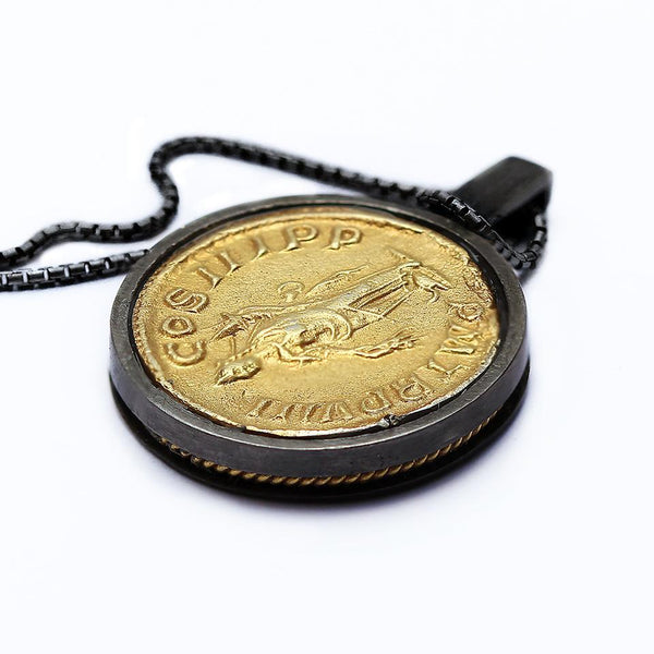 back side of a antique Roman coin necklace , a gold tone pendent