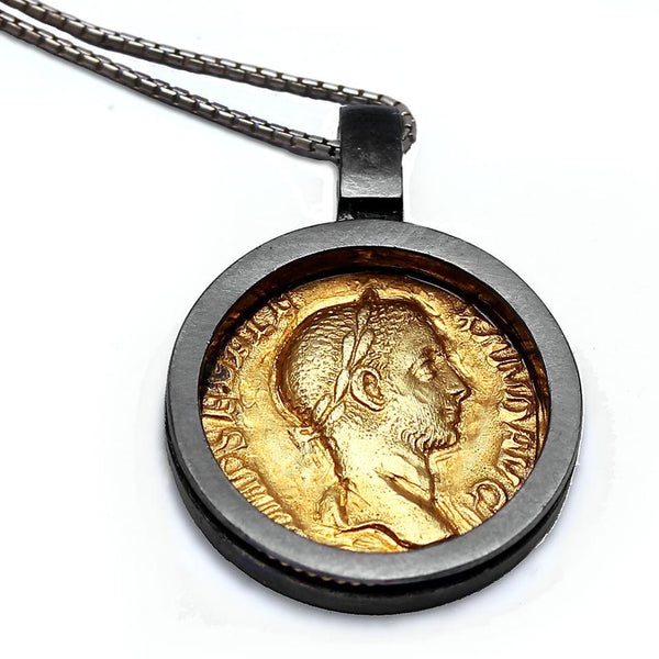 coin necklace with a  classic, elegant and dramatic contrast between the cold black rhodium and the warm gold 