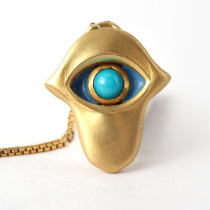 blue protective eye in the Hamsa hand necklace, sacred art of Jewish symbols 