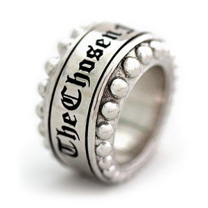 Cadi Sterling Silver ring with a bold round sphere stone set in a smooth sculptural band, engraved "The Chosen 1" and raised studs.