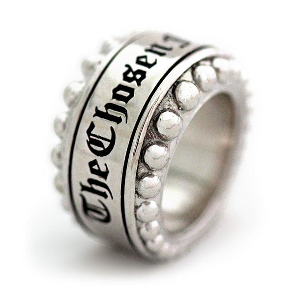 Cadi Sterling Silver ring with a bold round sphere stone set in a smooth sculptural band, engraved "The Chosen 1" and raised studs.