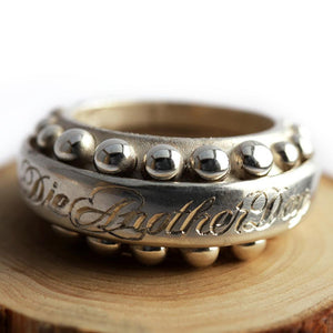 Cadi handcrafted Donut cocktail ring for women with a bold round sphere stone and sculptural band in engraved gold.
