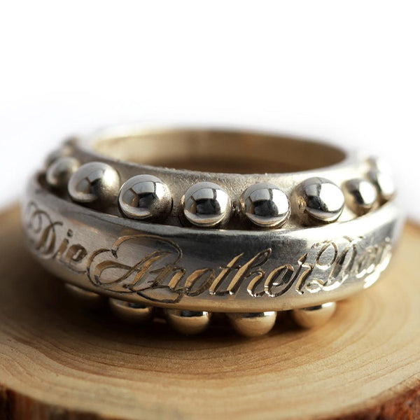 Cadi handcrafted Donut cocktail ring for women with a bold round sphere stone and sculptural band in engraved gold.