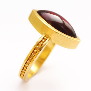 red Garnet gemstone on gold or silver engagement ring
