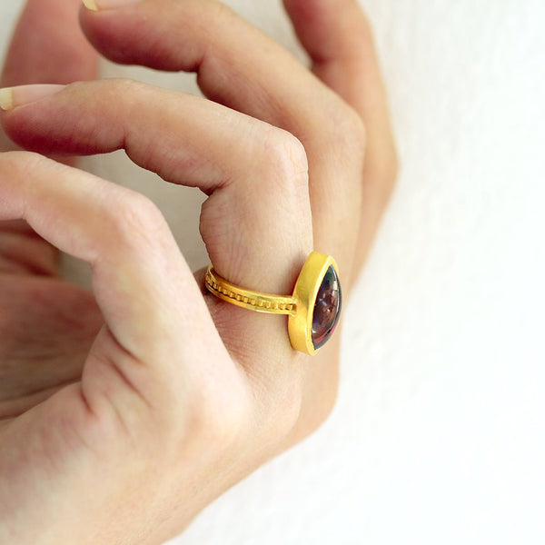 red Garnet gemstone on gold or silver engagement ring