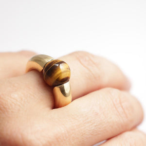 gold and Tiger eye stone ring on a woman's hand, a present from a lover