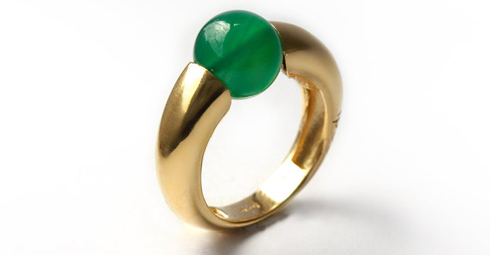 Green solitaire with rose gold combination ring donut