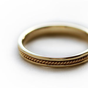 yellow gold twist male wedding band with braided filigree