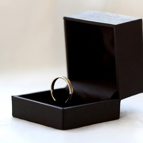 yellow gold twist male wedding band with braided filigree