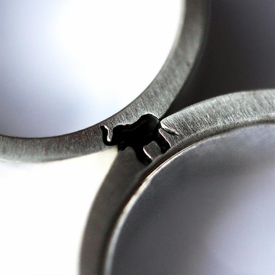 Couple rings set with engraved, elephant design