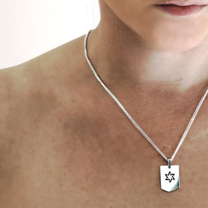 a David star army necklace on a women, a pendent created for both him and her graduation gift
