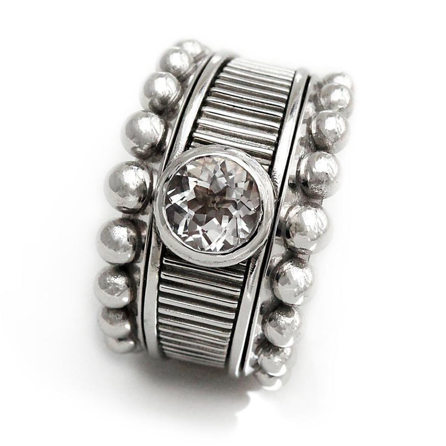 texture silver or gold ring with natural white Topaz stone