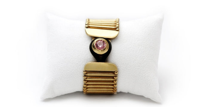 pink Cubic Zirconia gemstone in gold bracelet