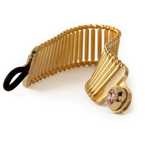 pink Cubic Zirconia gemstone in gold bracelet