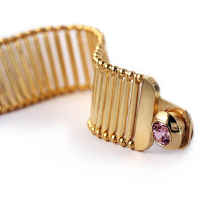 pink Cubic Zirconia gemstone in gold bracelet