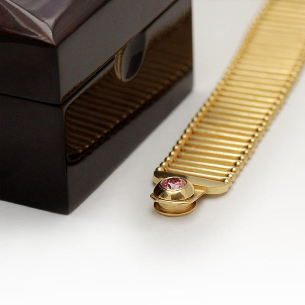 pink Cubic Zirconia gemstone in gold bracelet