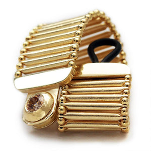 Yellow Cubic Zirconia Gemstone in gold bracelet
