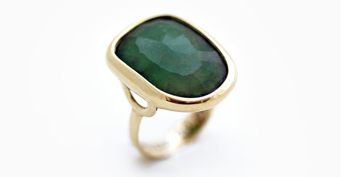 irregular natural green Emerald gem on yellow gold roca ring