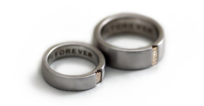 Two engraved heart rings set in silver with diamonds