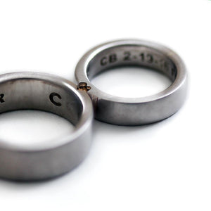 Two engraved heart rings set in silver with diamonds