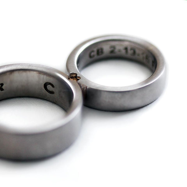 Two engraved heart rings set in silver with diamonds