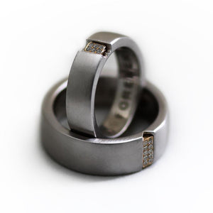 Two engraved heart rings set in silver with diamonds