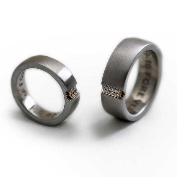 Two engraved heart rings set in silver with diamonds