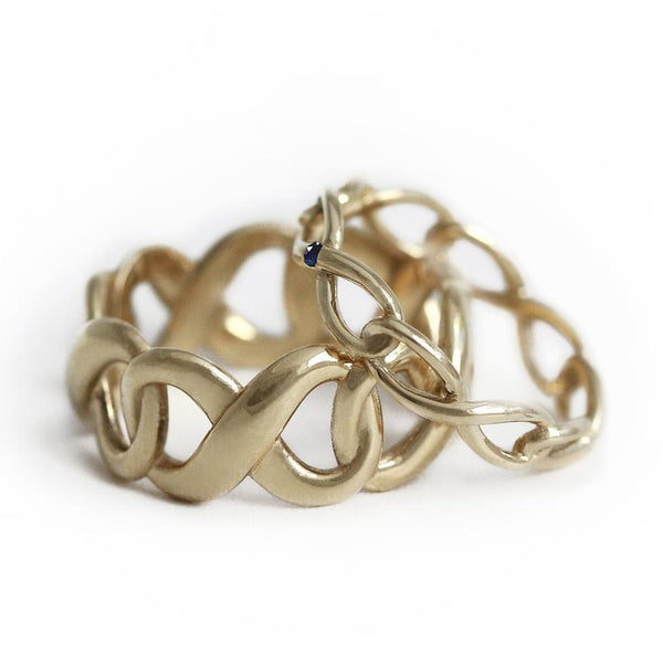gold set of his and hers promise rings with infinity shape