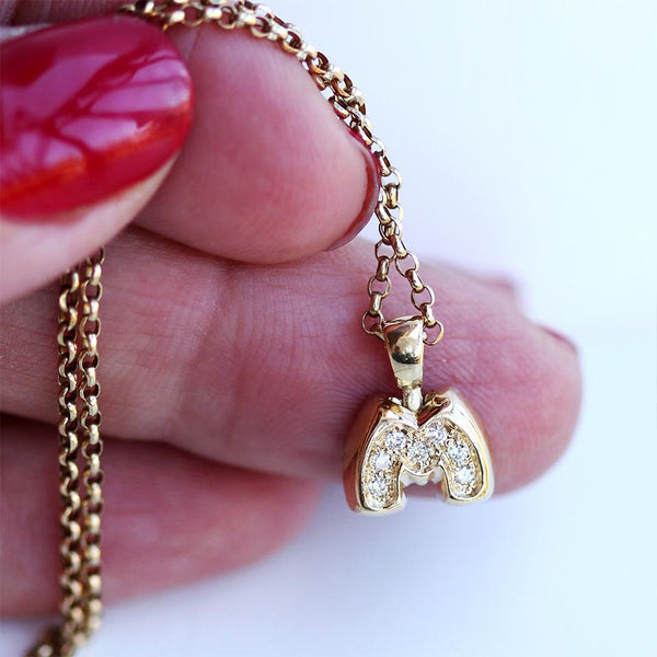 small personal necklace gift with round diamonds and personalized singular initial in 18k gold necklace
