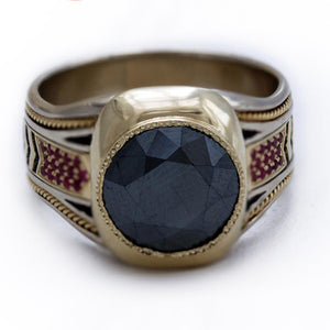 black Spinel gemstone on yellow and white gold with red Rubies ring