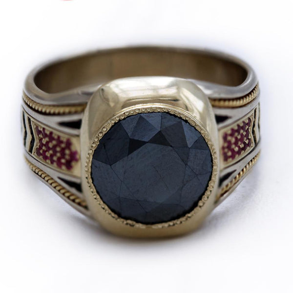 black Spinel gemstone on yellow and white gold with red Rubies ring