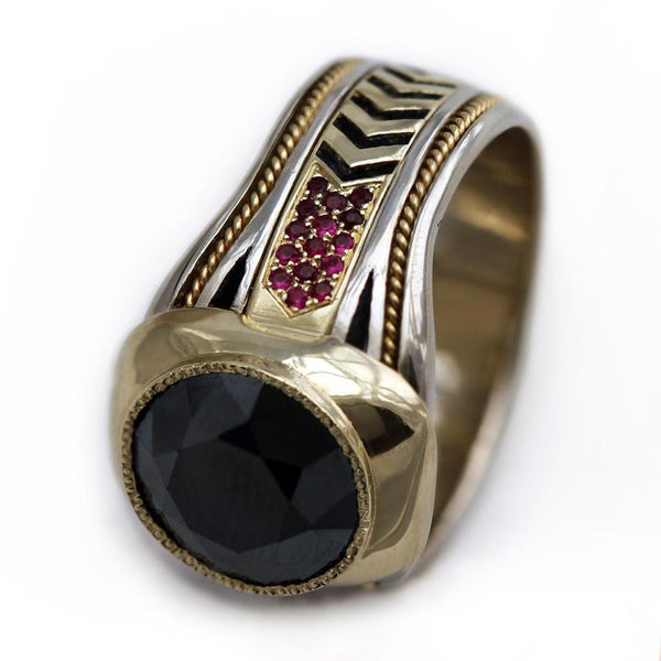 black Spinel gemstone on yellow and white gold with red Rubies ring