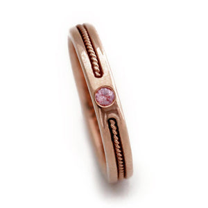 rose gold ring embedded with pink Sapphire gemstone