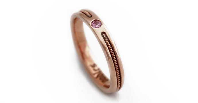 rose gold ring embedded with pink Sapphire gemstone