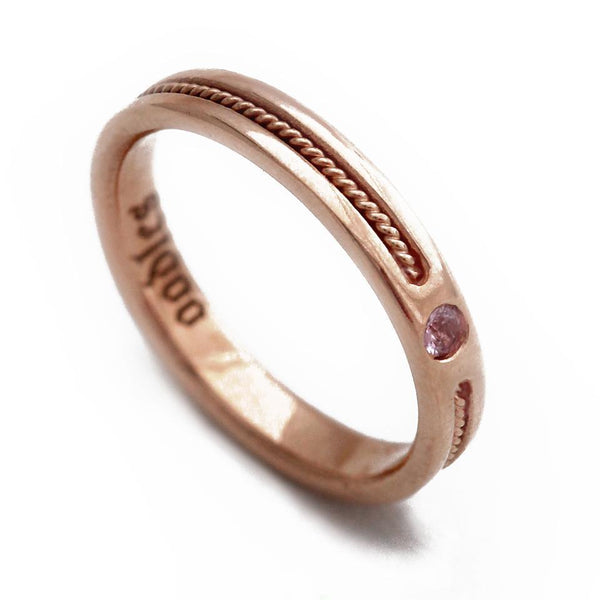 rose gold ring embedded with pink Sapphire gemstone