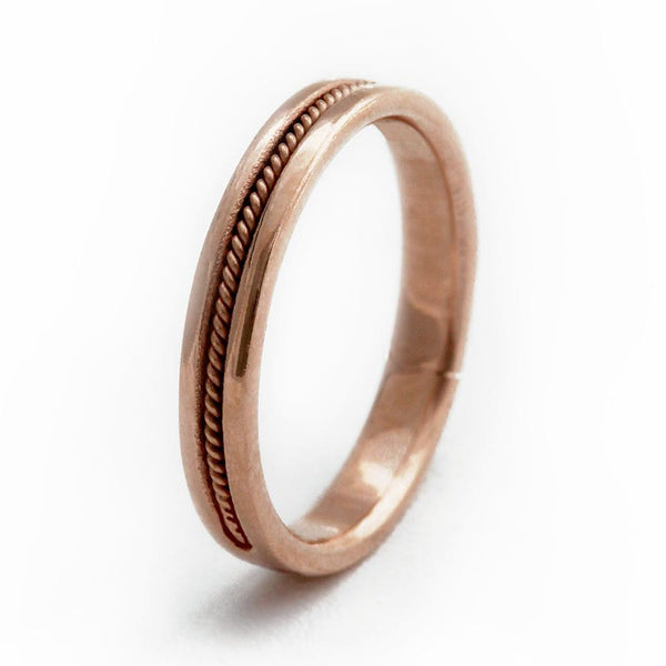 rose gold ring embedded with pink Sapphire gemstone