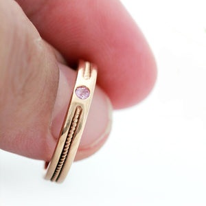 rose gold ring embedded with pink Sapphire gemstone