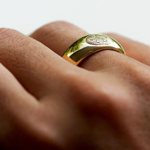 Hand wearing Armor solid gold and diamond promise ring engagement ring