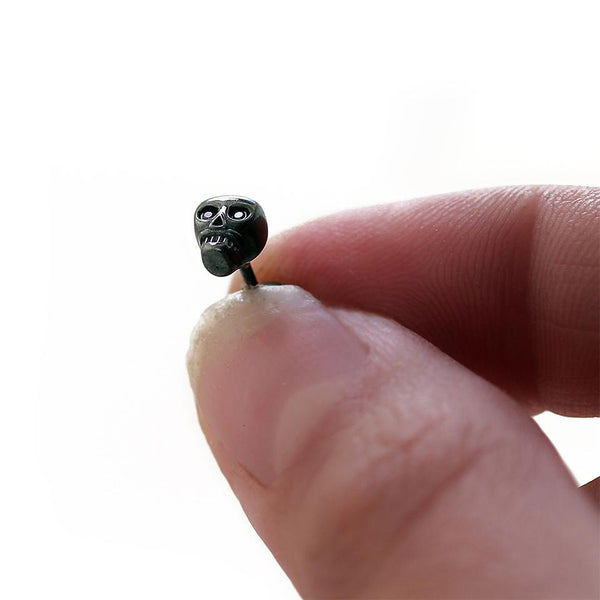 black skull with black Diamond eyes plated in gold or silver earrings