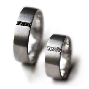 Pair of couples matching black and white Diamond engagement rings