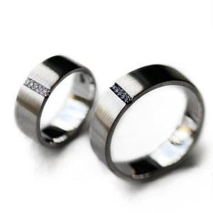 Pair of couples matching black and white Diamond engagement rings