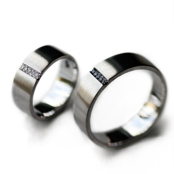 Pair of couples matching black and white Diamond engagement rings