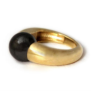 simle stone ring in a minimalist design using Black Hematite with gold 