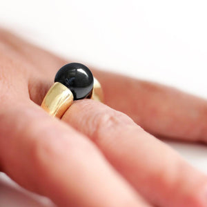large Black Hematite gold ring on a women's hand