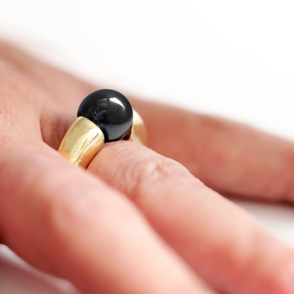 large Black Hematite gold ring on a women's hand