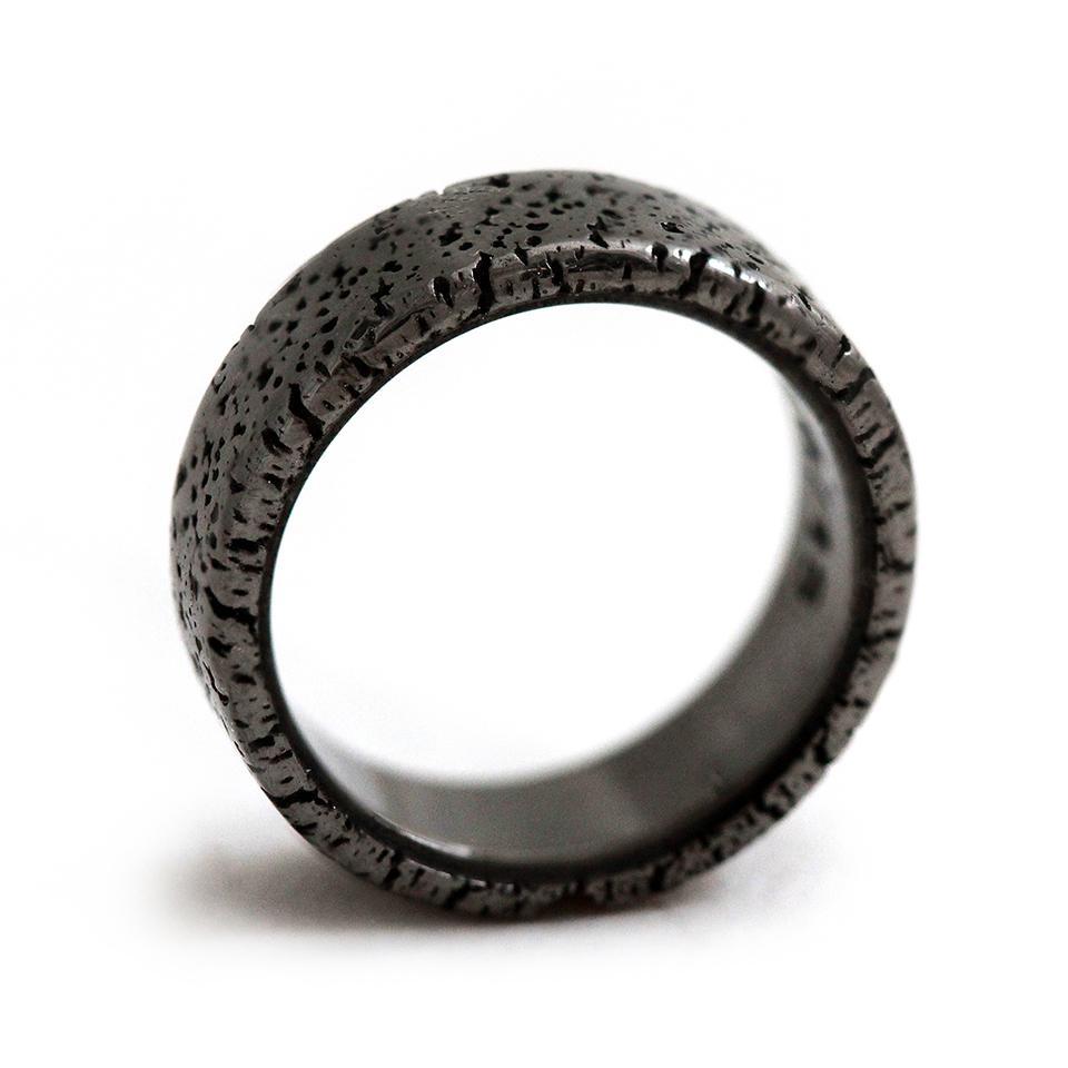 Cadi textured black wedding band with industrial lunar crater finish