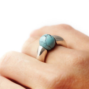 Turquoise ring on a hand the best combination for a stylish nautical classy look
